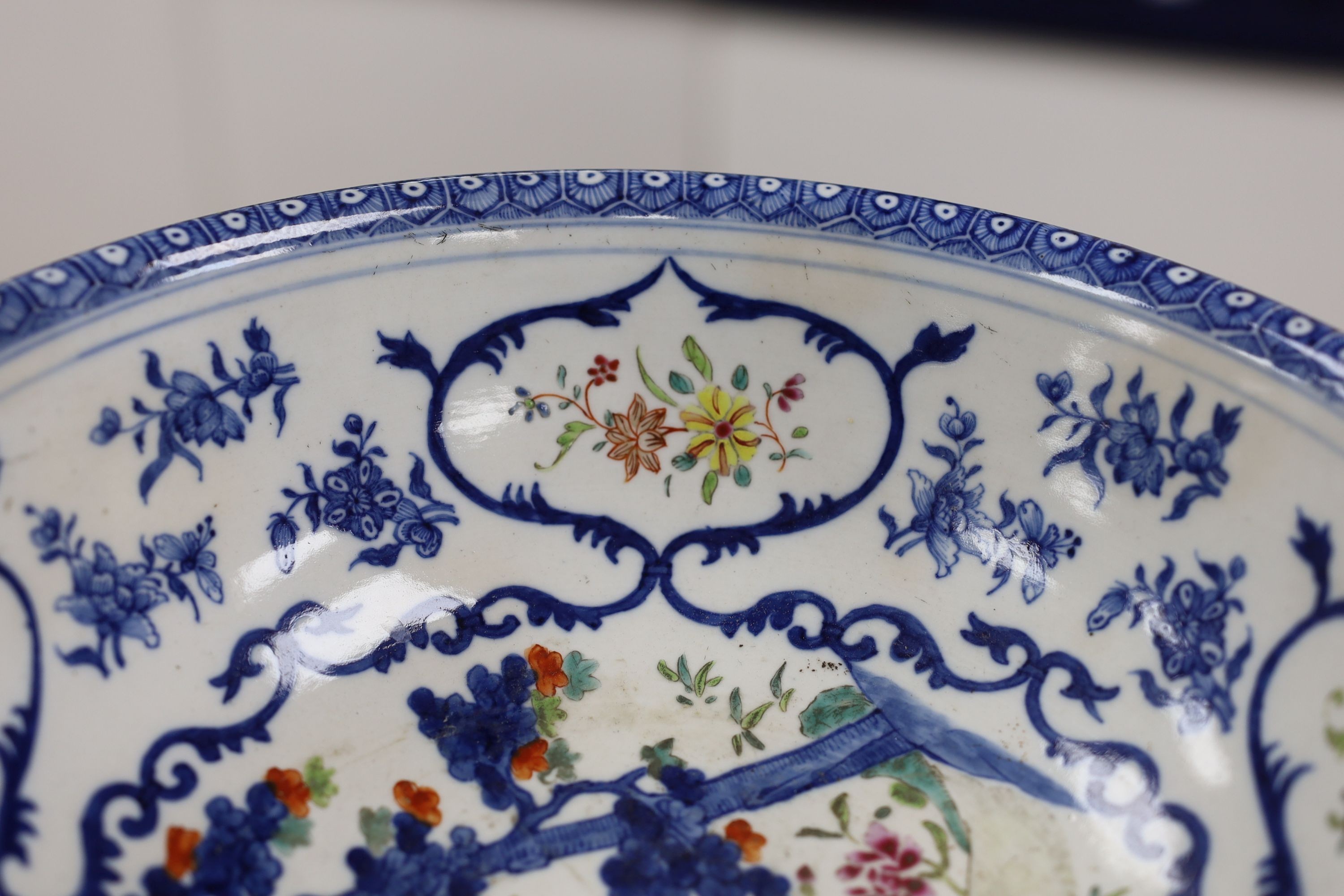 A Chinese underglaze blue and famille rose decorated basin or bowl, Qianlong period, 27 cm diameter